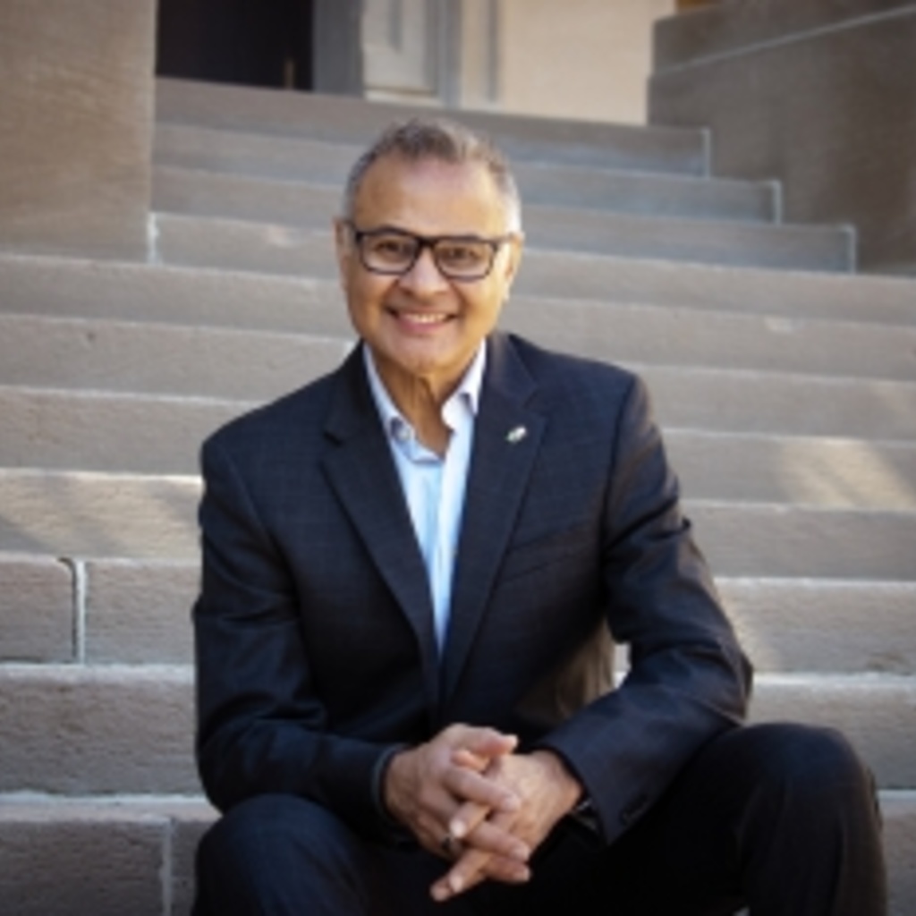 Armando Duarte sitting on stairs