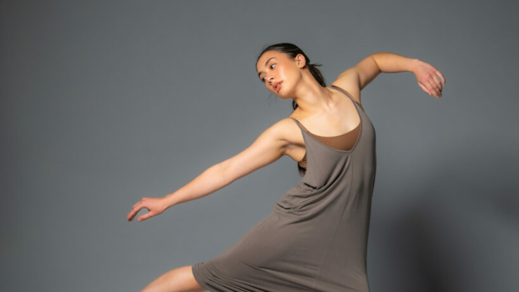 BFA senior Ellie Daley dancing in a studio photograph