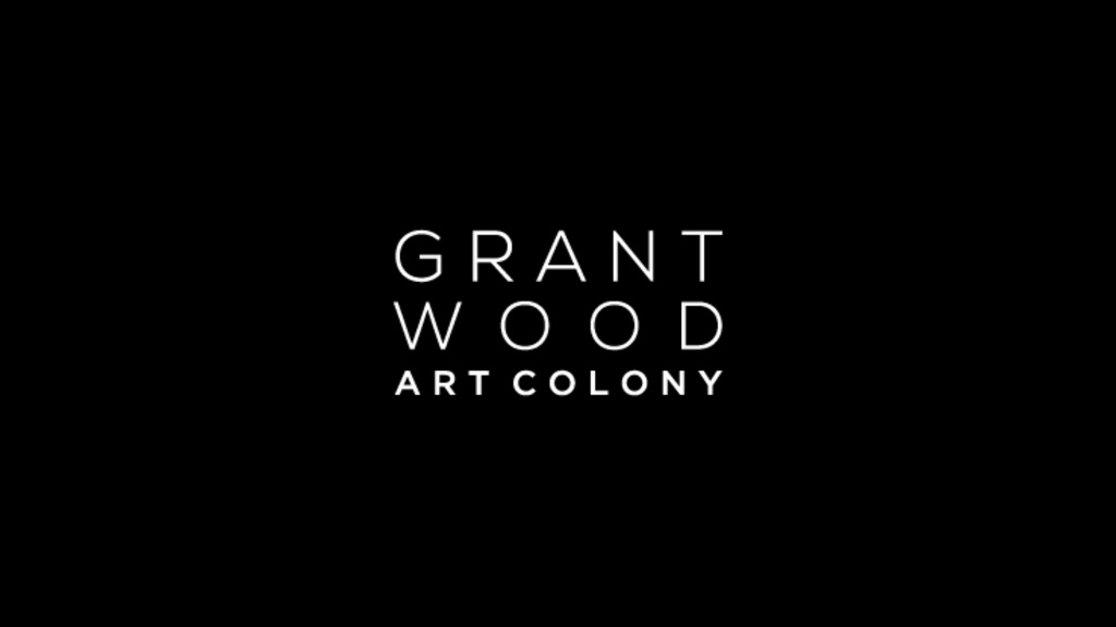 white grant wood art colony logo on black background